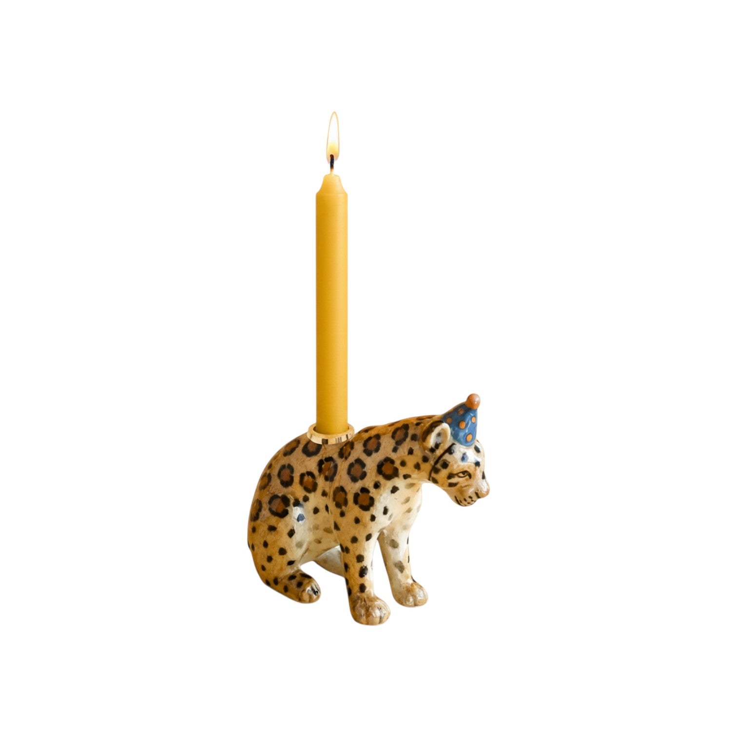 The Tiny Finch handcrafted jaguar cake topper with brown rosettes and a blue party hat holding a yellow candle.