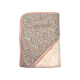 The Tiny Finch Juliette baby bath towel featuring floral Liberty fabric and soft pink sponge loop trim.