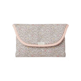 The Tiny Finch Juliette Liberty fleece travel changing mat folded into a compact floral pouch with pink trim.