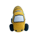 The Tiny Finch yellow knitted organic cotton mixer truck rattle toy for babies on a light blue background.