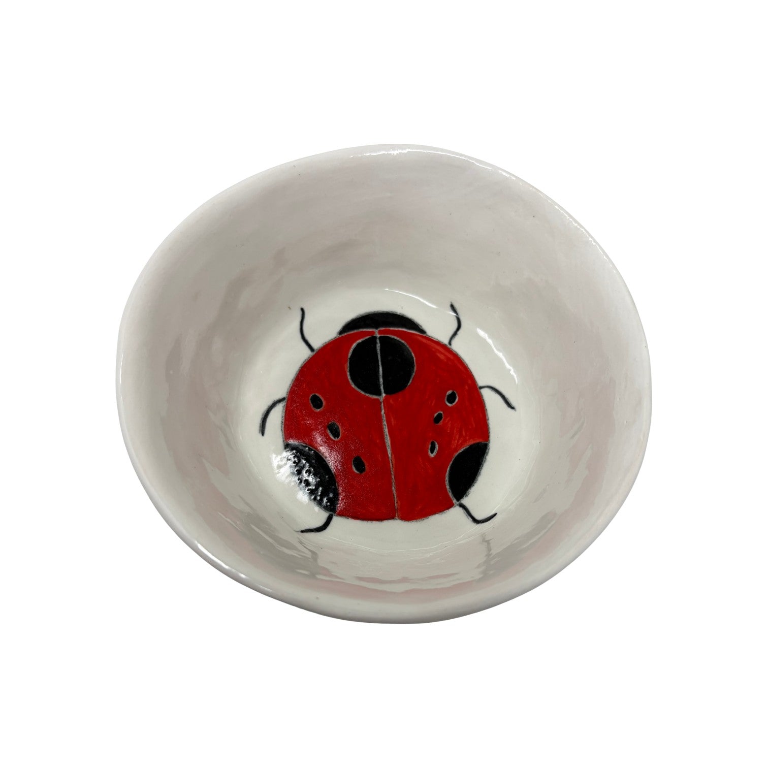 The Tiny Finch ceramic snack bowl featuring a hand-painted red and black ladybug design on a white background.