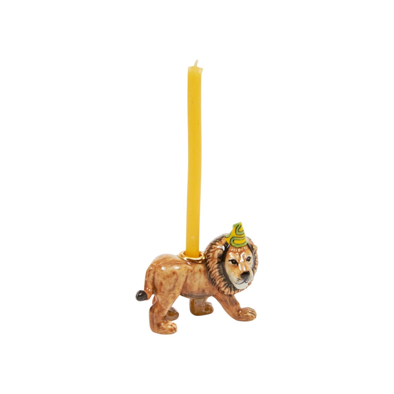 The Tiny Finch lion cake topper featuring a hand-painted ceramic lion wearing a party hat with a yellow candle.