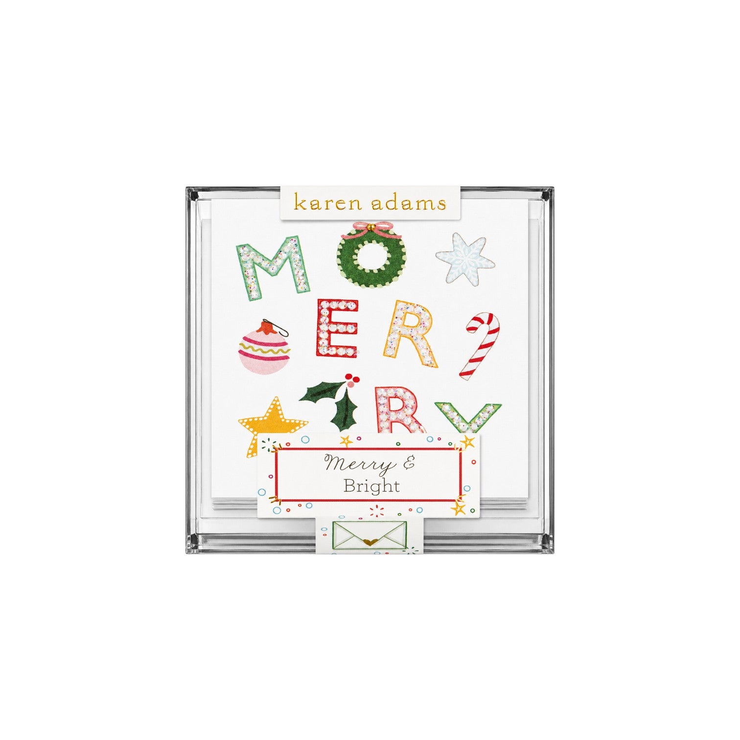 The Tiny Finch Merry holiday gift enclosure cards with hand-glittered festive icons in a clear acrylic box.
