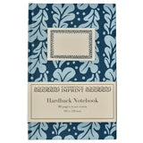 The Tiny Finch Cambridge Imprint hardback notebook in midnight blue with a light blue oak leaf pattern and cream label
