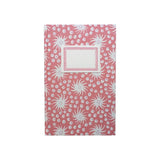 The Tiny Finch hardback notebook in pink and old red with a Milky Way star pattern and a cream rectangular label.