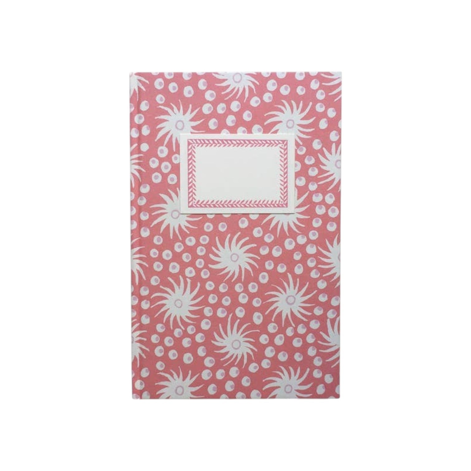 The Tiny Finch hardback notebook in pink and old red with a Milky Way star pattern and a cream rectangular label.