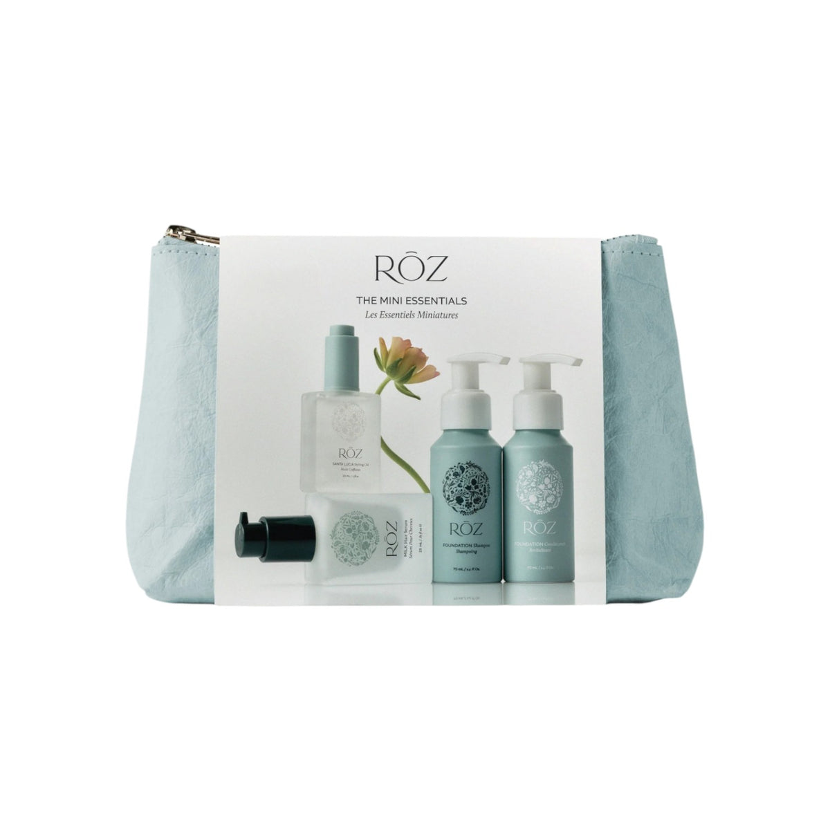 The Tiny Finch Mini Essentials Kit in a seaglass blue pouch featuring ROZ hair care travel-sized products.