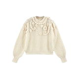 The Tiny Finch Moritz cream alpaca blend sweater with hand-embroidered floral embellishments and a loose knit texture.