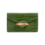 The Tiny Finch Pamela Munson Jackie clutch in moss green croc-embossed leather with a natural bamboo closure.