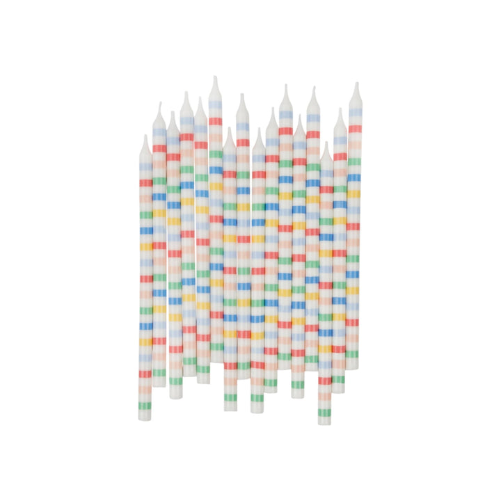 The Tiny Finch pack of 16 white wax birthday candles featuring colorful horizontal stripes for cakes and cupcakes.