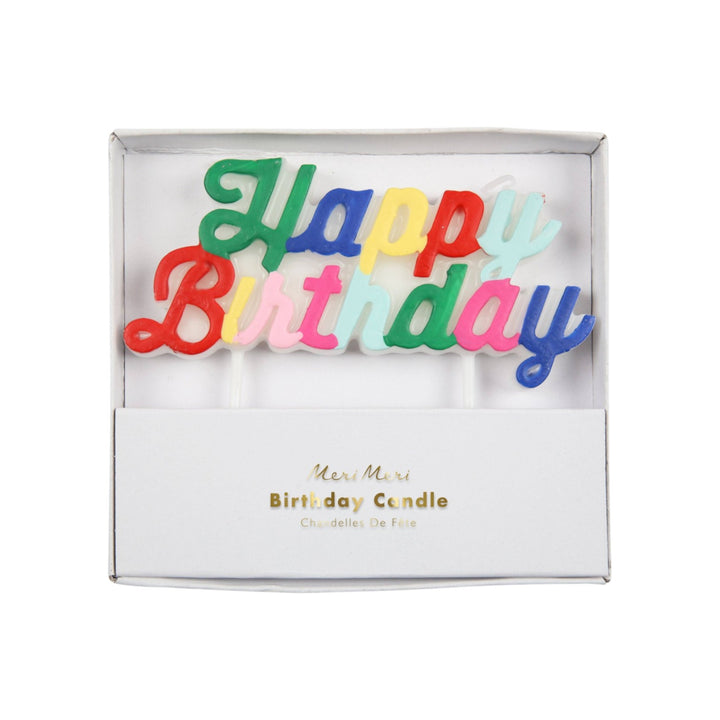 The Tiny Finch multicolour Happy Birthday cake candle in elegant curling script lettering inside a white gift box.