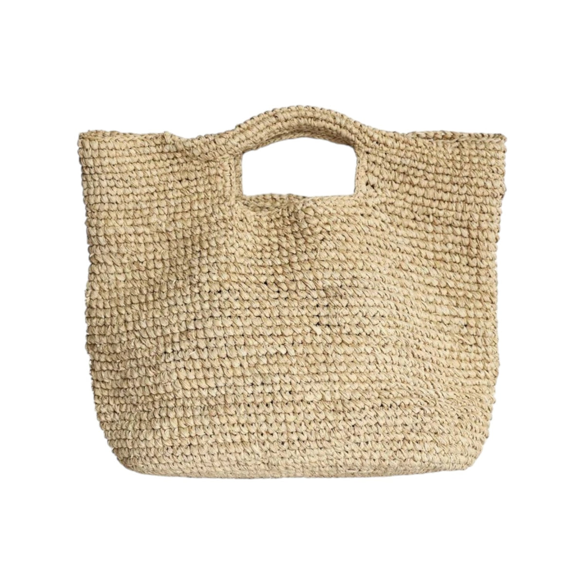 The Tiny Finch Marina bag in natural raffia with a square shape and cutout handles for a flexible organic look.
