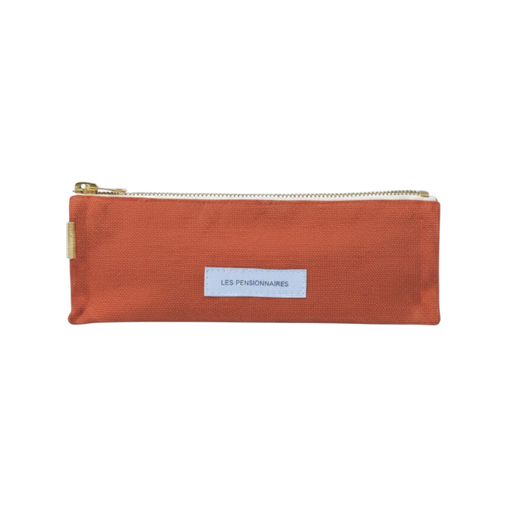 The Tiny Finch Les Pensionnaires orange organic cotton canvas pencil case with a gold zipper and rectangular label.