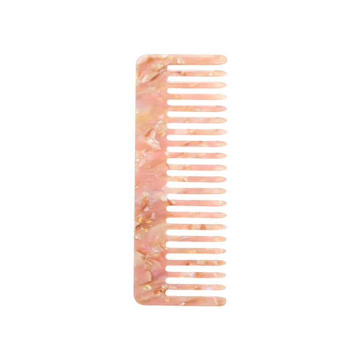 The Tiny Finch Comb Blossom wide-tooth hair comb in a pink and white marbled Italian acetate finish.