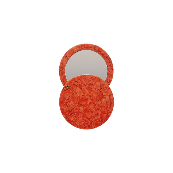 The Tiny Finch poppy red circular pocket mirror made from handmade Italian acetate with a swivel opening mechanism.