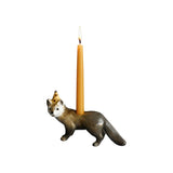 The Tiny Finch porcelain mink cake topper candle holder featuring a hand-painted mink wearing a party hat.