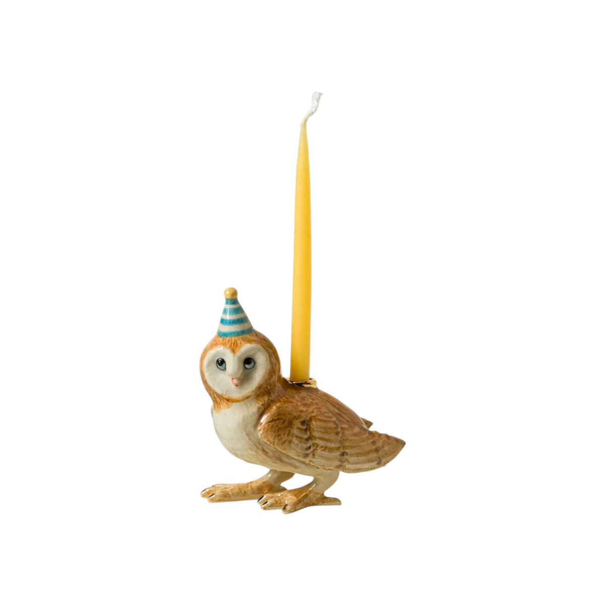 The Tiny Finch porcelain barn owl candle holder wearing a blue and white striped party hat with a yellow taper candle.