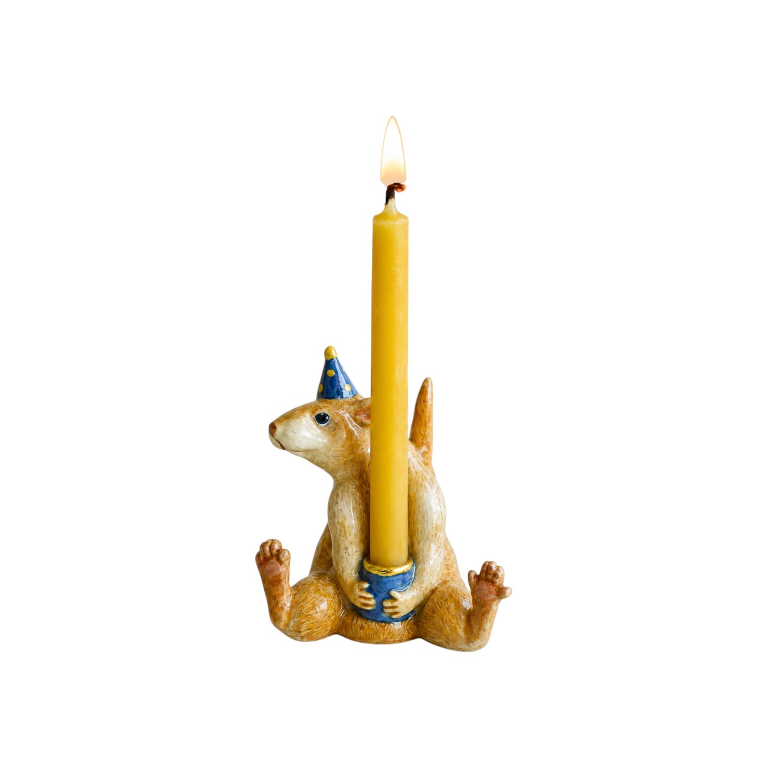 The Tiny Finch porcelain rat cake topper wearing a blue party hat and holding a lit yellow taper candle