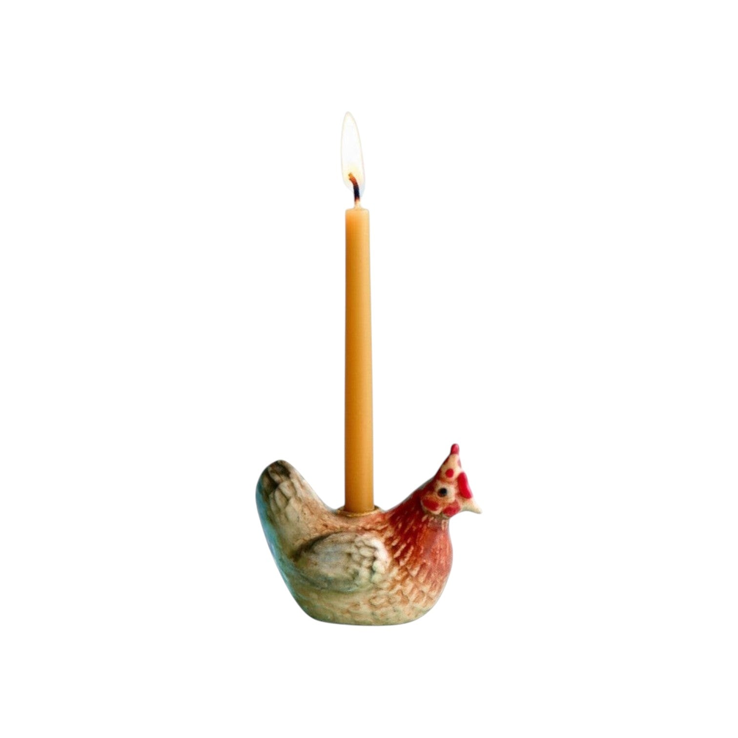 The Tiny Finch hand-painted porcelain rooster cake topper holding a lit taper candle for special occasions.