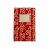 The Tiny Finch hardback notebook in Quercus Pomegranate featuring a red and pink oak leaf pattern with a cream label.
