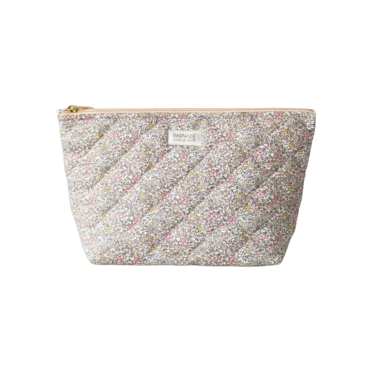 The Tiny Finch Juliette baby toiletry bag in quilted floral Liberty fleece fabric with a gold zipper closure.