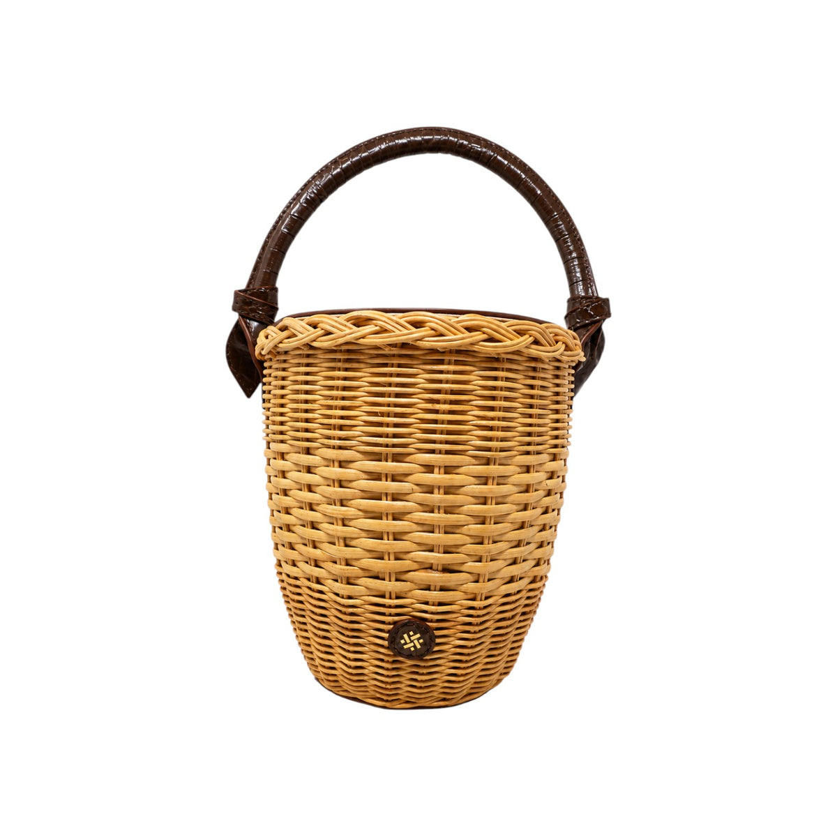 The Tiny Finch Pamela Munson Jane bag in chocolate, a handwoven rattan basket with lizard-embossed leather handle.