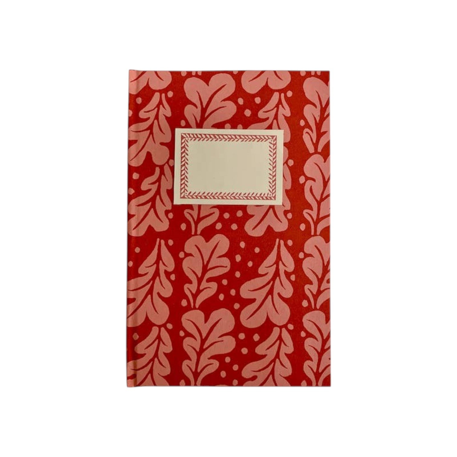 The Tiny Finch hardback notebook in red Quercus pomegranate pattern with a cream rectangular label on the cover.