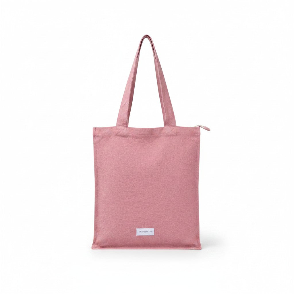 The Tiny Finch rosewood organic cotton canvas tote bag with a secure zip closure and interior pocket.