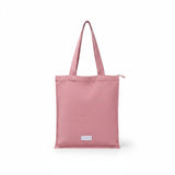 The Tiny Finch rosewood organic cotton canvas tote bag with a secure zip closure and interior pocket.