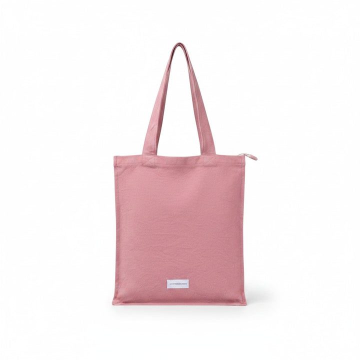 The Tiny Finch rosewood organic cotton canvas tote bag with a secure zip closure and interior pocket.