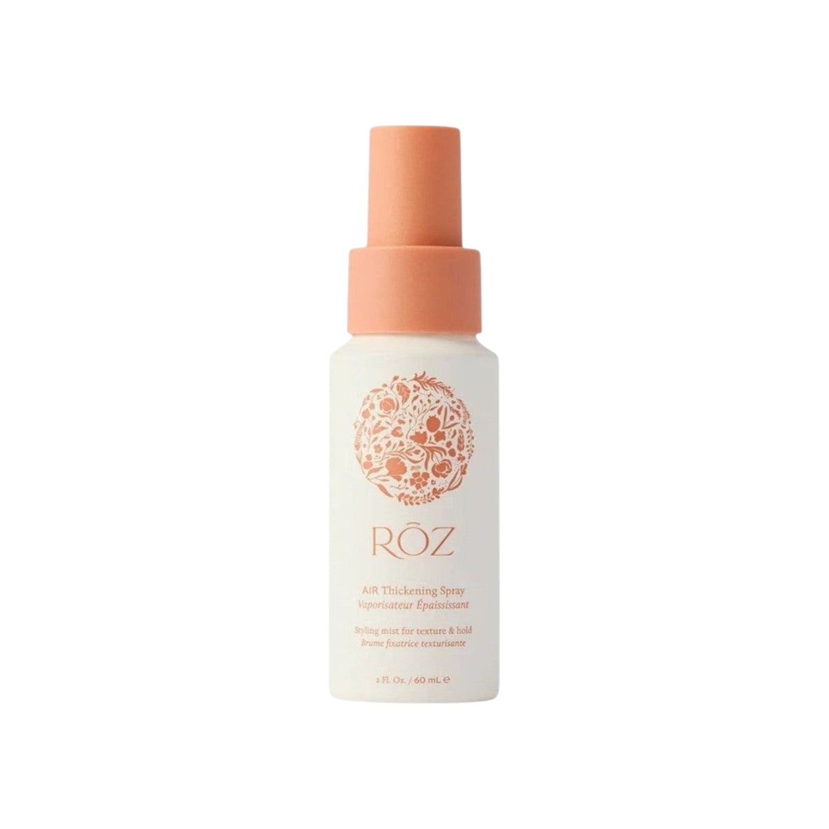 The Tiny Finch ROZ Air Thickening Spray in a travel-sized white bottle with a peach cap and floral logo design.