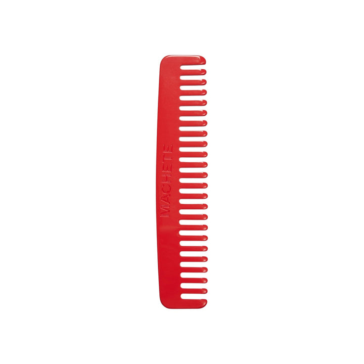 The Tiny Finch ruby red wide-tooth travel comb handcrafted from Italian bio-acetate for all hair types.