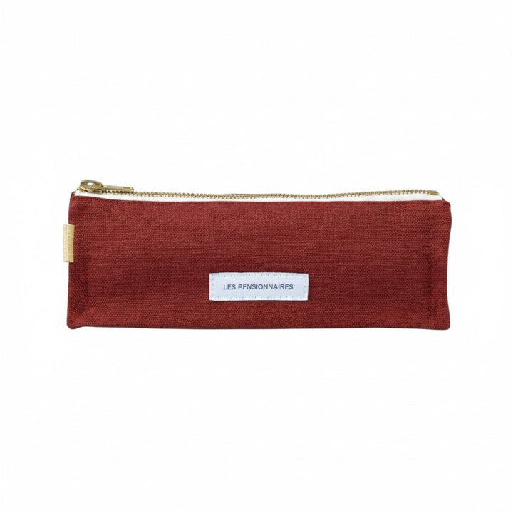 The Tiny Finch Les Pensionnaires rust organic cotton canvas pencil case with a gold zipper and white brand label.