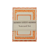 The Tiny Finch Sea Urchin neon notecard set with patterned borders and coordinating envelopes in orange and white.