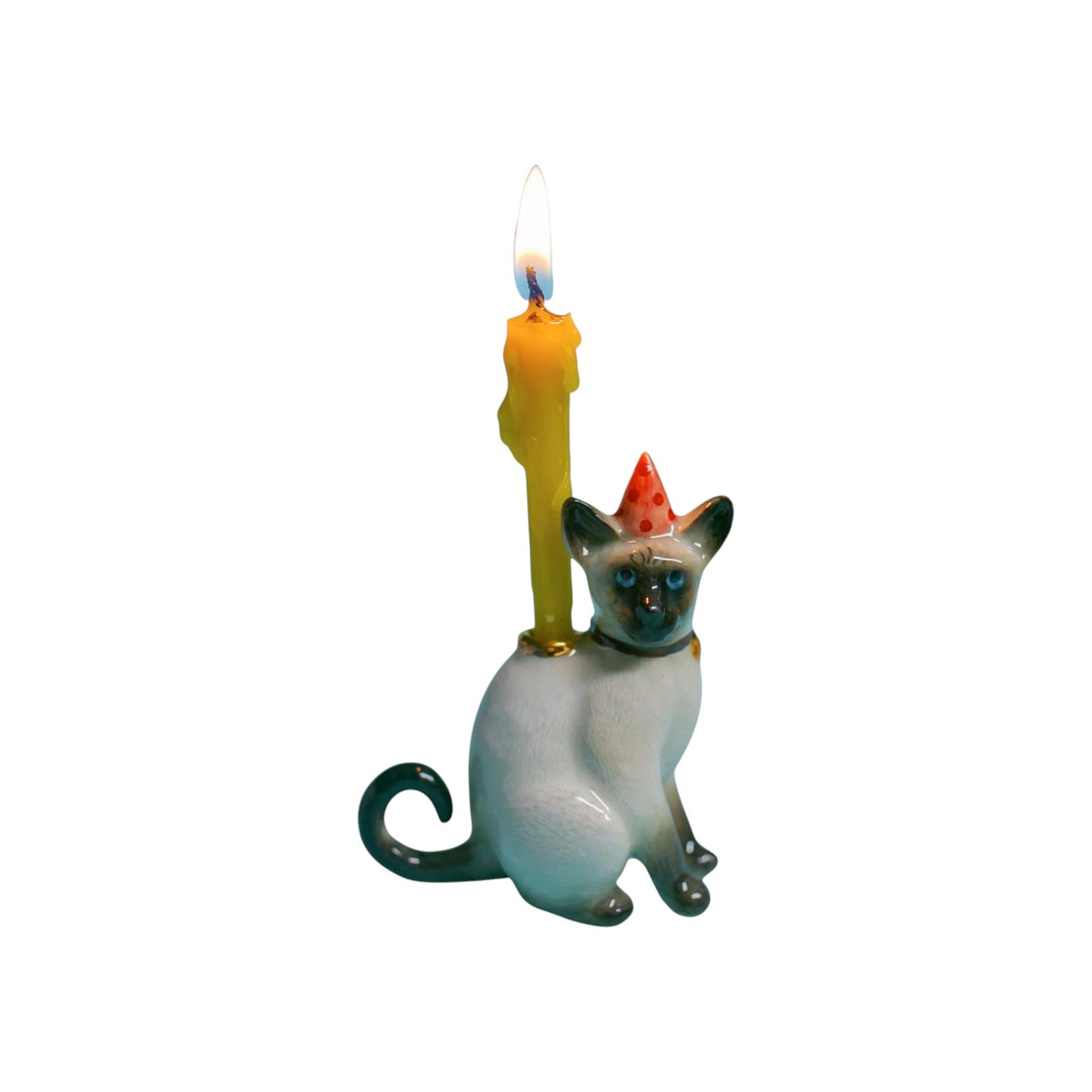 The Tiny Finch Siamese cat cake topper with a party hat and a lit yellow candle for birthday celebrations.