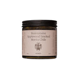 The Tiny Finch Flamingo Estate biointensive applewood smoked morita chile honey in a glass jar with black lid