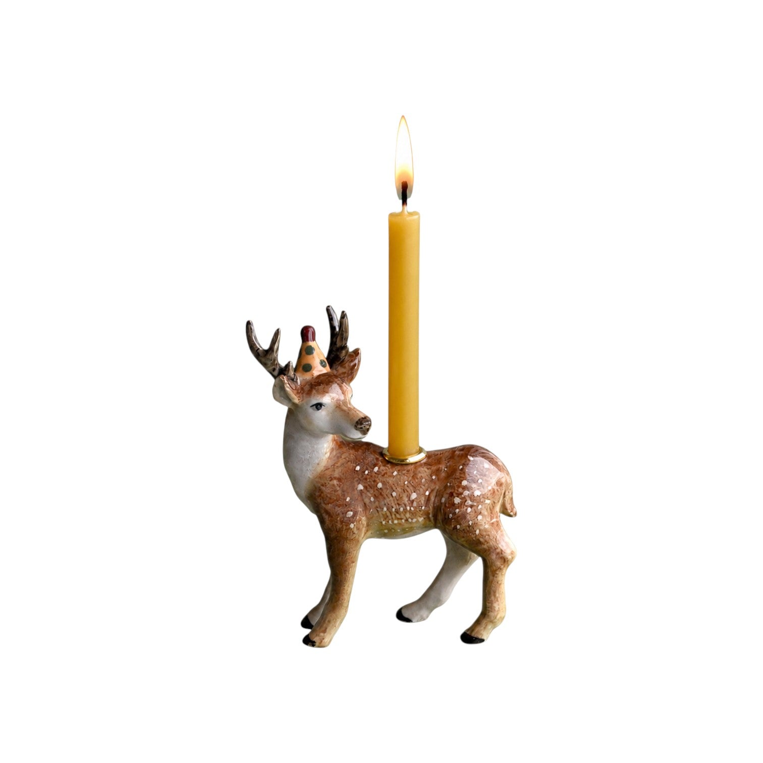 The Tiny Finch ceramic stag cake topper featuring a spotted deer wearing a party hat and holding a tall yellow candle.