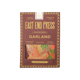 The Tiny Finch East End Press Thanksgiving garland in recycled paper with orange and ochre hand-printed motifs.