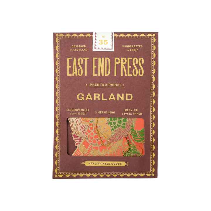 The Tiny Finch East End Press Thanksgiving garland in recycled paper with orange and ochre hand-printed motifs.