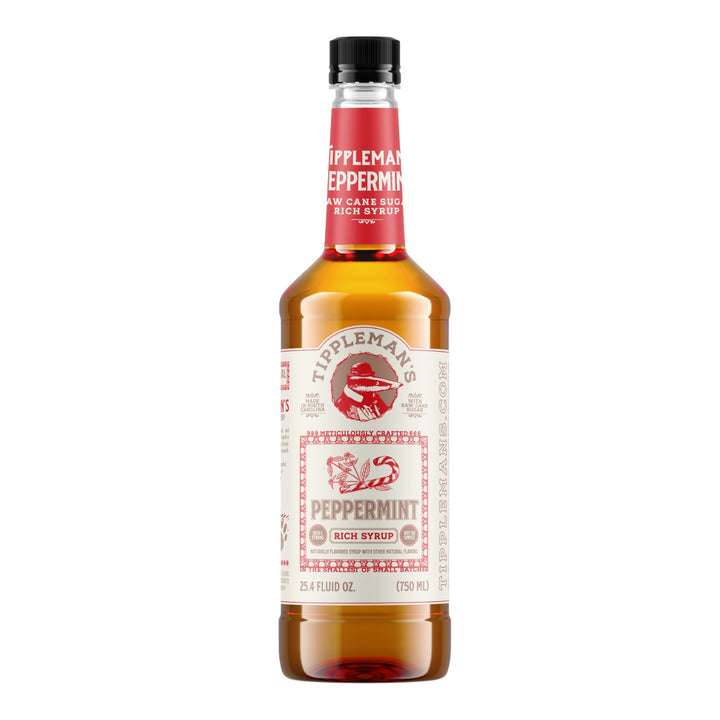 The Tiny Finch Tippleman's peppermint raw cane sugar syrup in a 750ml glass bottle with a red and white label.