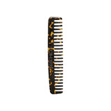 The Tiny Finch travel wide-tooth comb in dark tortoise bio-acetate, suitable for all hair types and textures.