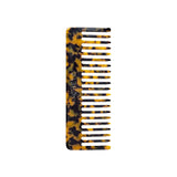The Tiny Finch wide-tooth hair comb in classic tortoise shell pattern, handcrafted from Italian acetate.