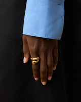 The Tiny Finch Victoria ring in 18k gold-plated sterling silver featuring a sculptural layered fluid design