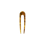 The Tiny Finch French hair pin in modern walnut brown Italian acetate with a classic U-shaped design
