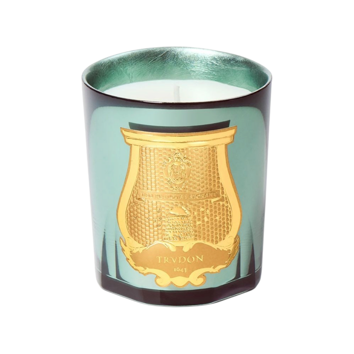 The Tiny Finch La Nuit des Glaces fir candle in a celadon lacquered glass vessel with silver leaf and gold emblem.