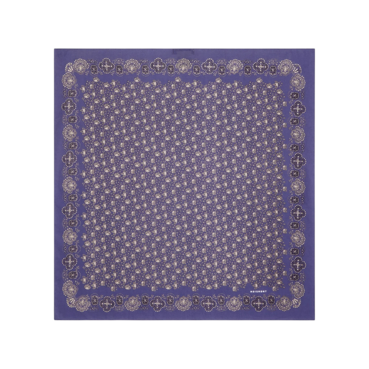 The Tiny Finch Moismont Milan square cotton scarf in twilight blue with intricate ecru patterns and rolled edges.